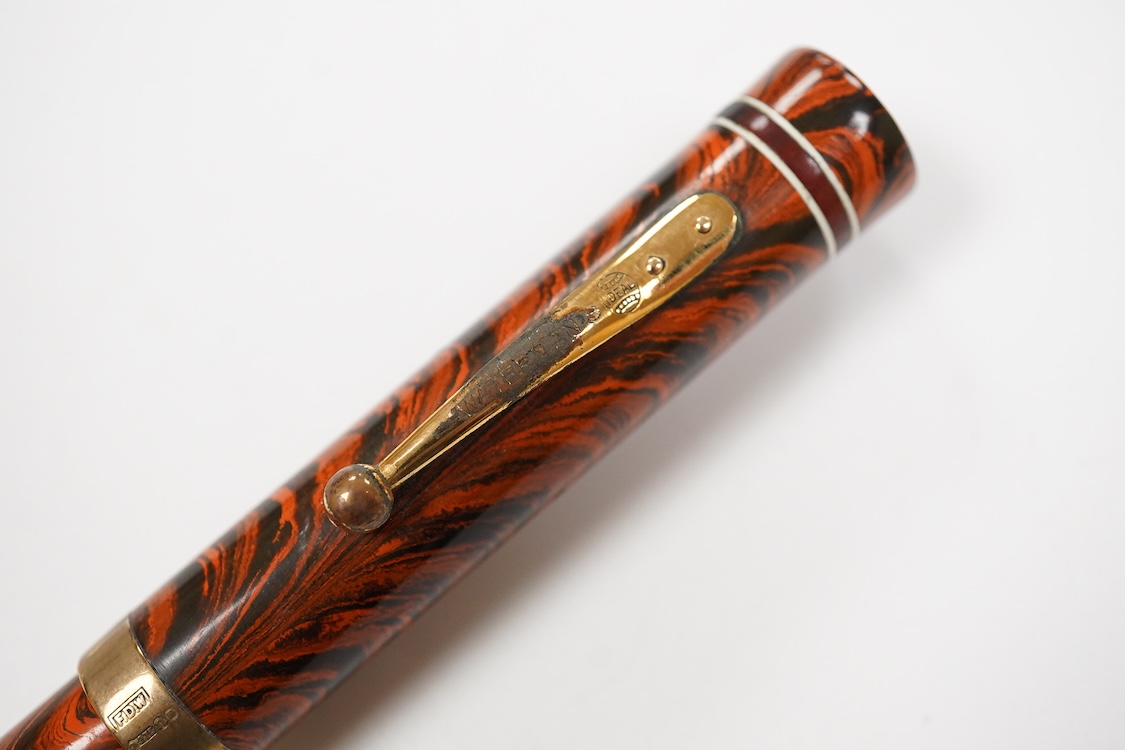 A Waterman Red Ripple No. 5 lever fitted with red cap band and filled with No.2 Waterman nib